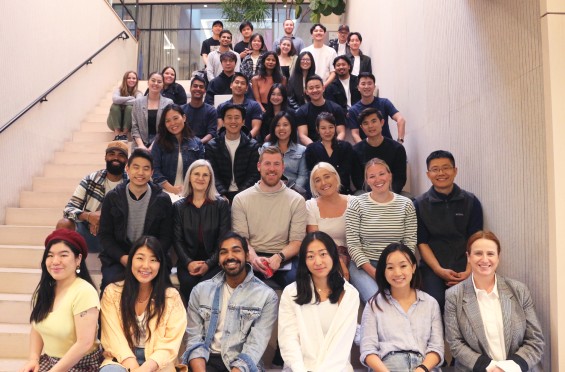 A group of smiling asian'stars posing for a picture